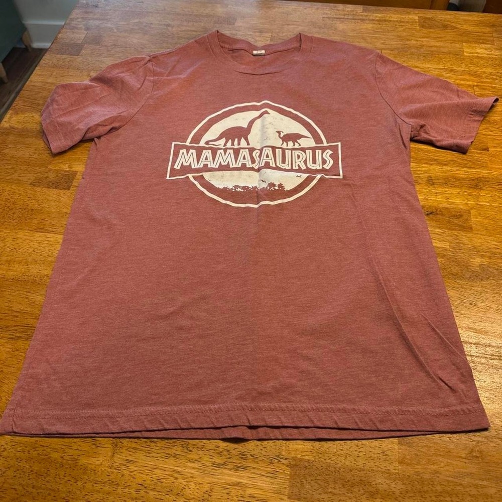 Mamasaurus t-shirt with white Jurassic Park-style logo featuring dinosaurs